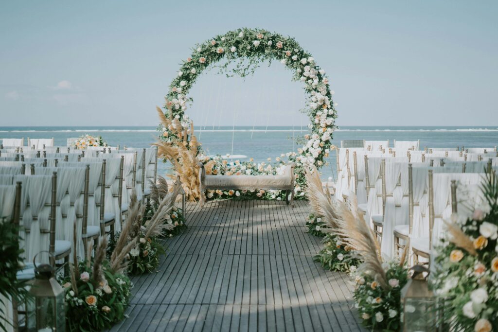 beautiful white floral wedding arch and floral design for wedding guests